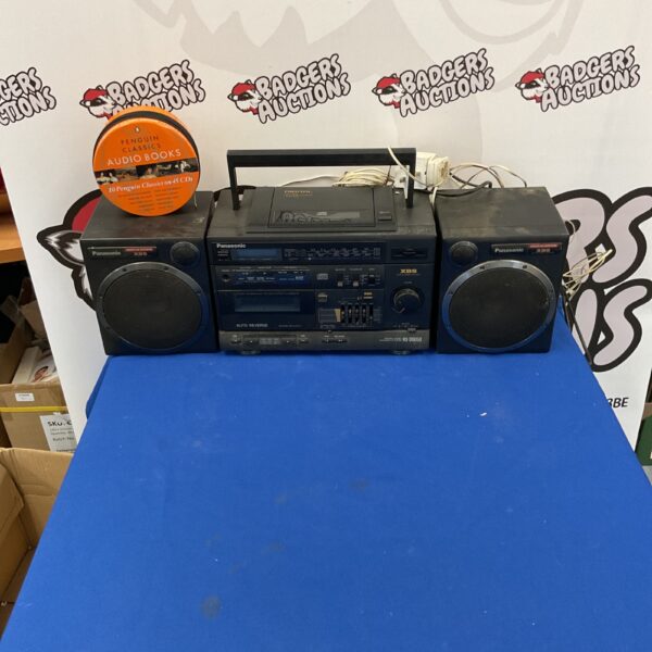 Vintage Panasonic RX-DS650 portable stereo system with Penguin Classics books.