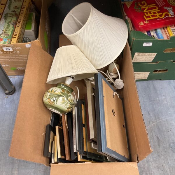 Mixed lot of vintage photo frames and a table lamp for home decor.