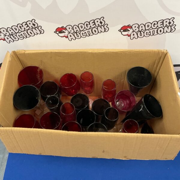 Lot of red and black wine glasses for sale.