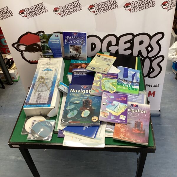 Lot of sailing books and navigation kit for learning seamanship.