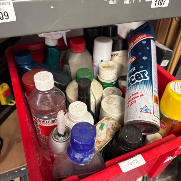 Assorted shed clearance chemicals in a plastic storage box.