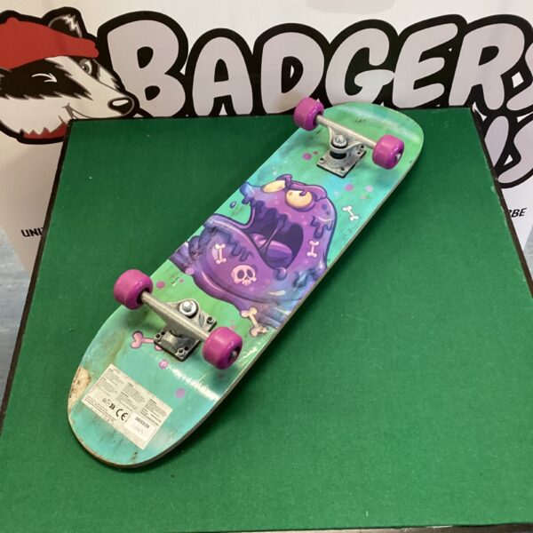 Colourful Smiths Toys skateboard with monster graphic.