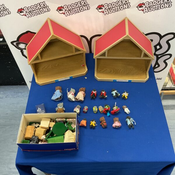 Vintage Sylvanian Families collection with houses and furniture.