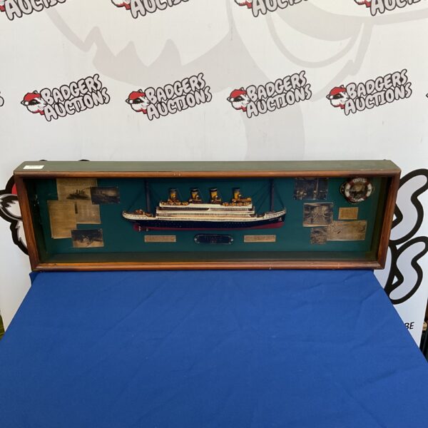 Framed Titanic diorama, detailed ship model, nautical decor.