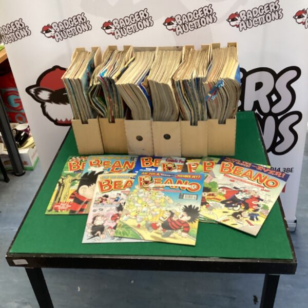 Lot of six vintage Beano comics in protective holders.