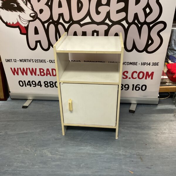 Vintage wooden bedside cabinet with a single door.