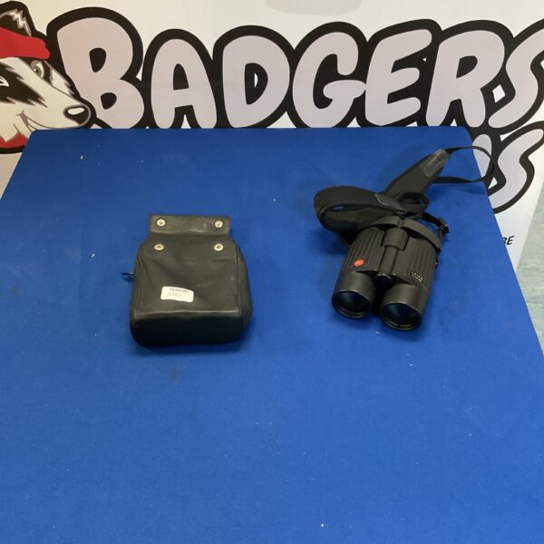 Vintage Bushnell binoculars with carrying case displayed.