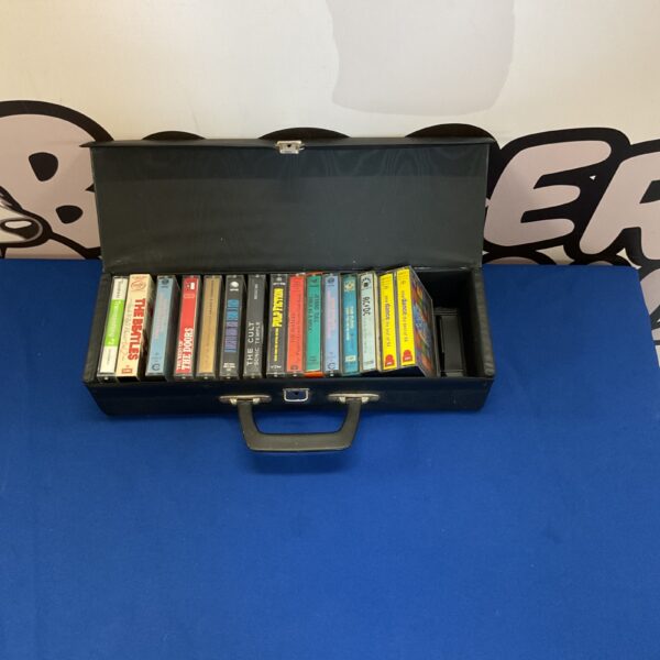 Vintage cassette tape case with tapes inside, retro music storage.