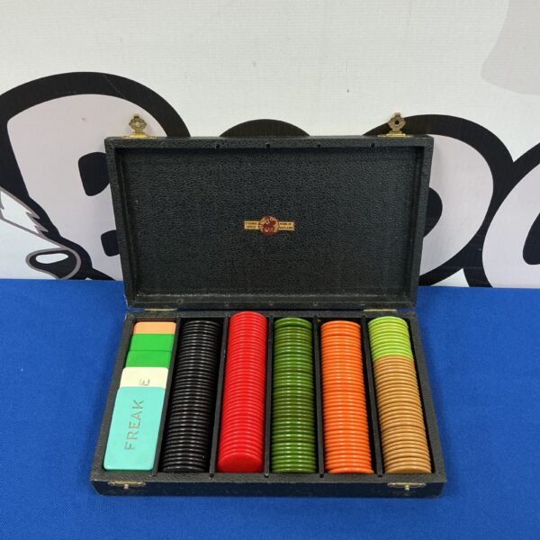 Vintage gaming chips in a case, collectible casino chips.