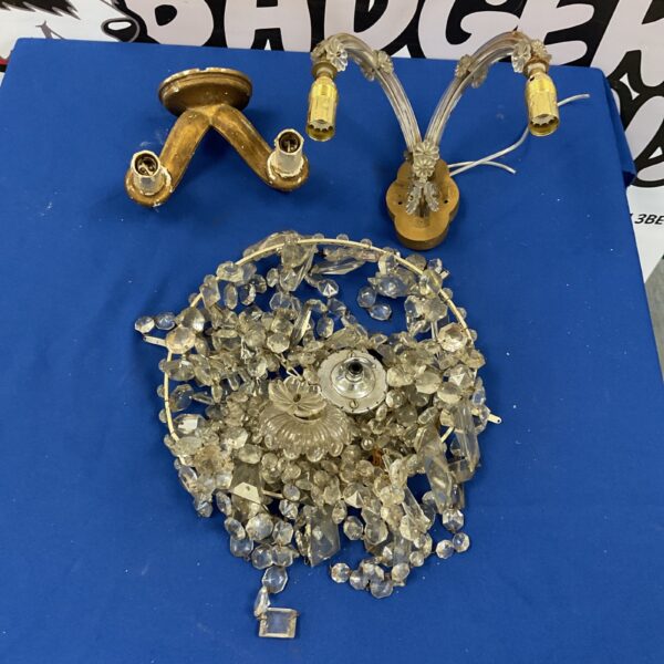 Vintage glass chandelier and two wall lamps, sparkling mid-century lighting.