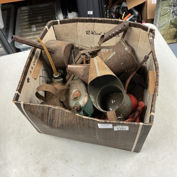 Assorted vintage metal oil droppers and jugs in a lot.