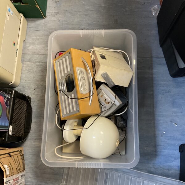 Bright yellow vintage radio in a lot of radios.