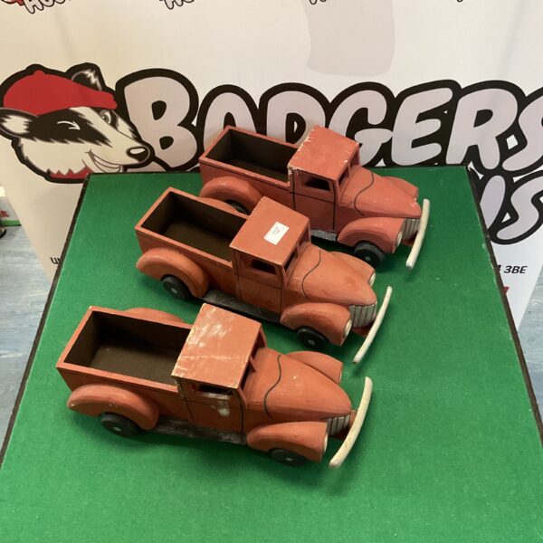 Vintage wooden model trucks, a charming collectible lot.