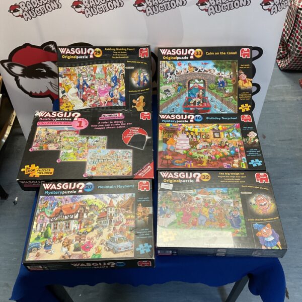 Wasgij puzzle lot featuring six colourful jigsaw puzzles.