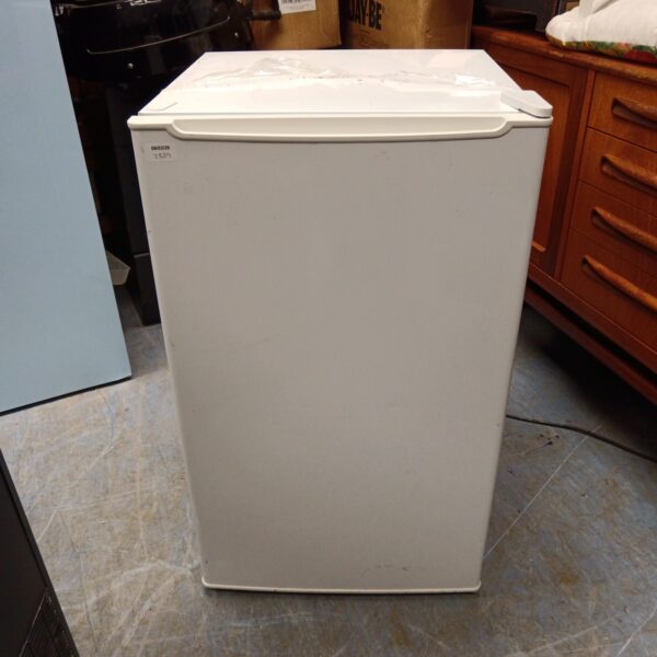 White under counter fridge for kitchen storage.