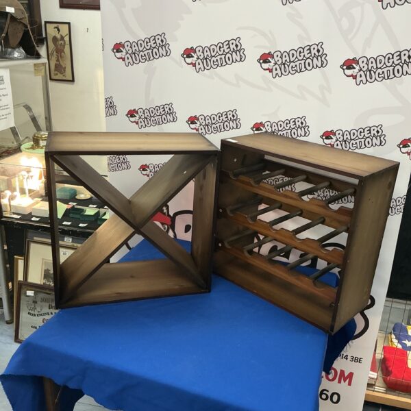 Vintage wooden bottle rack for wine display and storage.