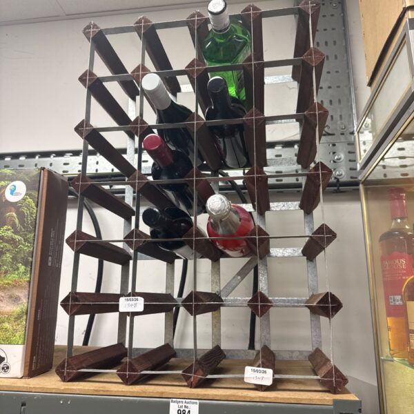Wooden wine bottle rack holding bottles of wine and gin.