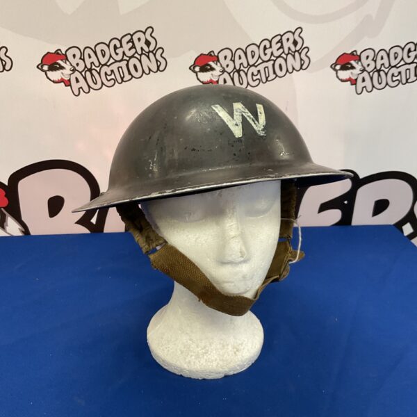 Vintage WWII Warden’s steel helmet with liner and chinstrap.