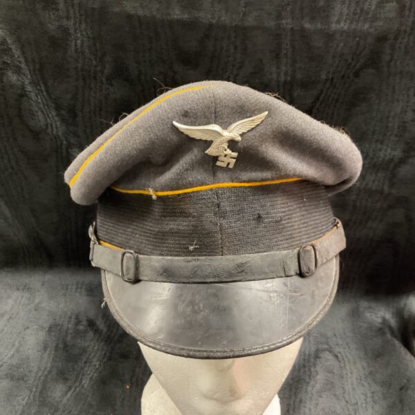 WWII German Luftwaffe peaked cap with eagle emblem.